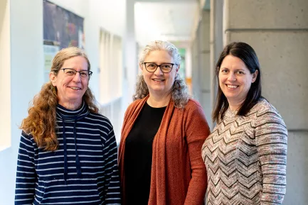 WWU&#039;s Shannon Warren, Tracy Coskie and Emily Borda smile for the camera inside the SMATE building on campus.