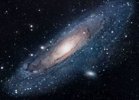 M31, Andromeda Galaxy, a collection of blue particles surrounding a bright white center