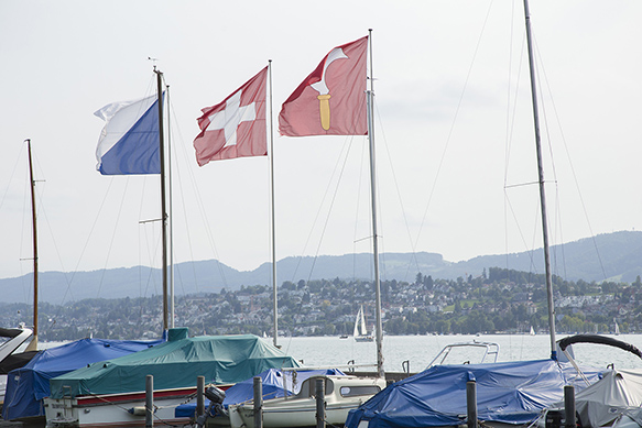 Three flag in a marina