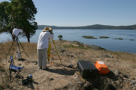 student doing a survey of a lake
