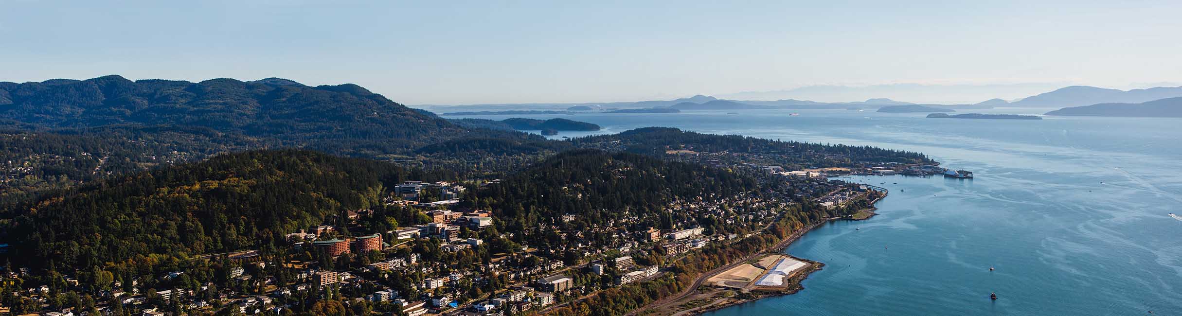 The Western campus viewed from the air looking out towards the islands and Bellingham bay