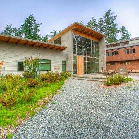 glass front, modern Anacortes college building stands in a landscaped area