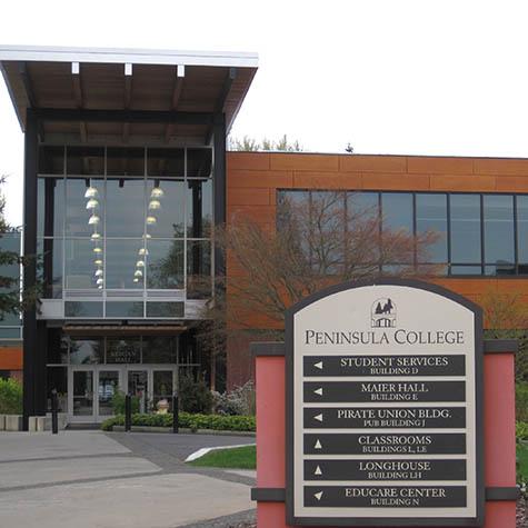 Port Angeles college building front entrance with the Peninsulas College signage out front, a Western Washington University, wwu college location