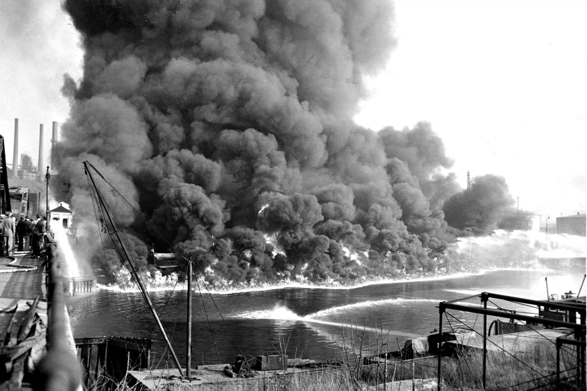Cleveland's Cuyahoga River burns in 1969 as fire crews scramble to put out the blaze