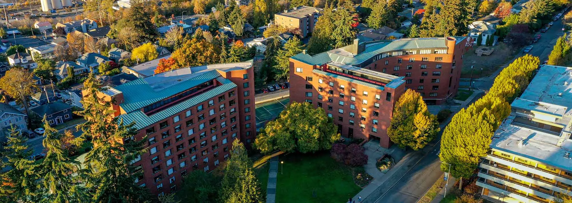 Aerial view of Mathes, Nash, and Higginson Halls, brick buildings at the north end of campus