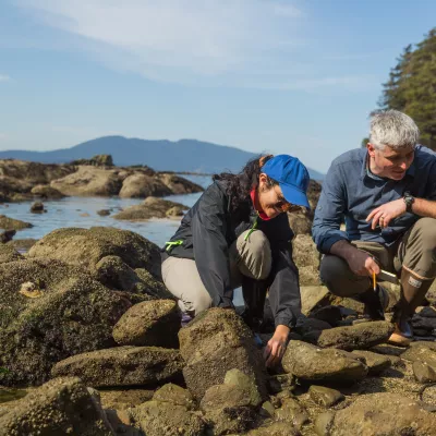 A Western professor and student collecting tide pool samples