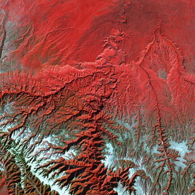 Red image of a river system with blue accents along the bottom