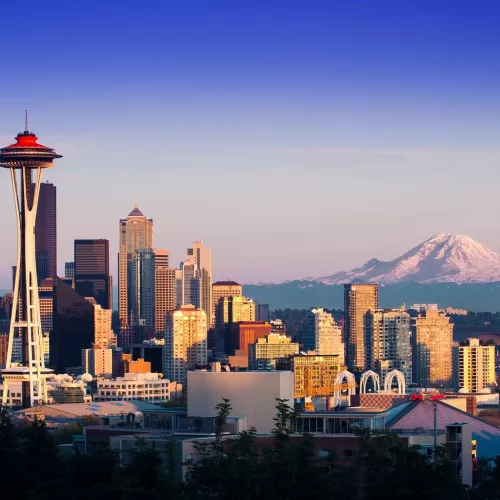 The skyline of Seattle, with the Space Needle and Mt. Rainier visible.