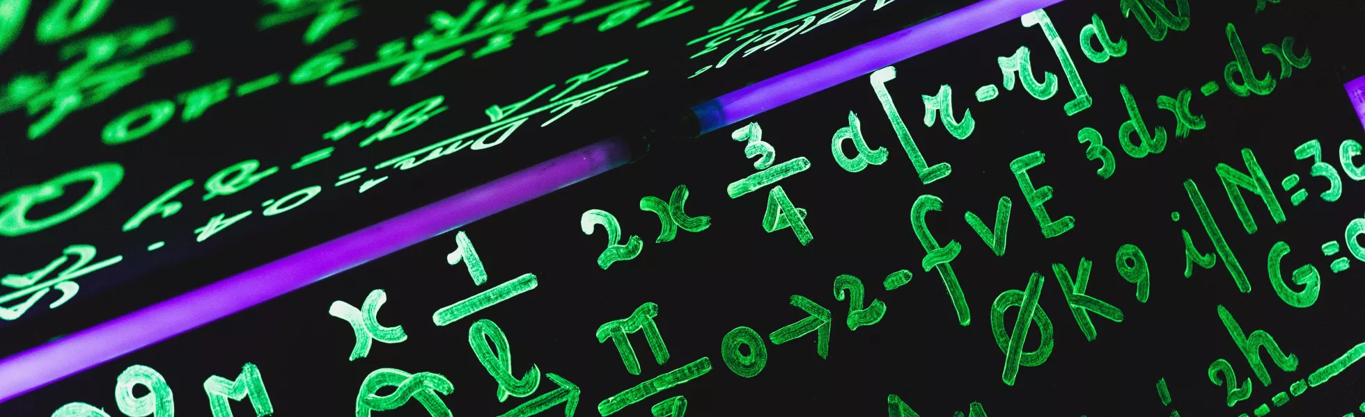 Green math equations illuminated by a uv light