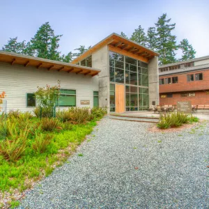 glass front, modern Anacortes college building stands in a landscaped area